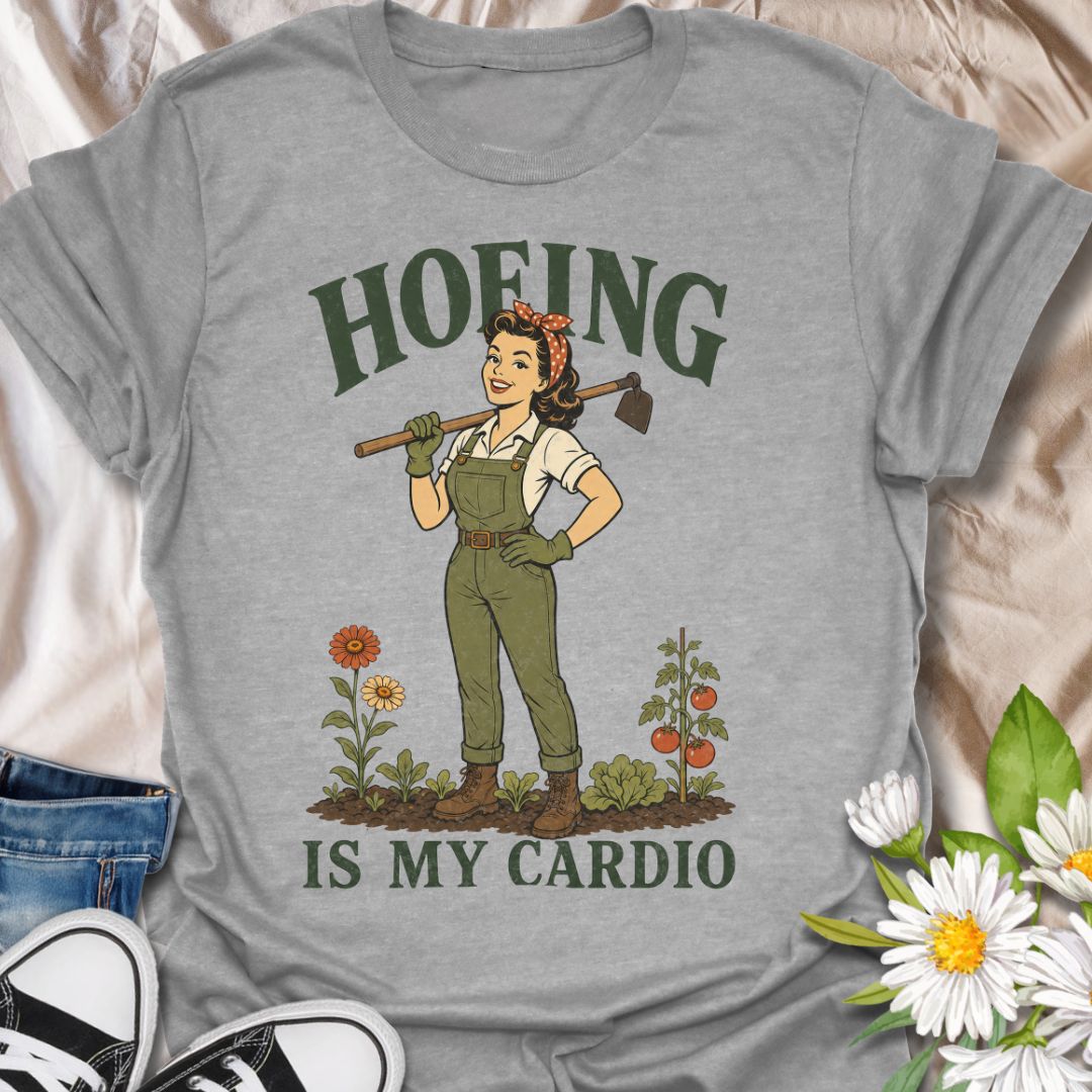 This Hoeing Is My Cardio t-shirt is made for gardeners who know working the soil, pulling weeds, and tending the vegetable patch absolutely counts as exercise. Featuring a vintage-style gardener holding a hoe, with flowers, tomatoes, greenery, and bold retro lettering, this design has a funny garden-humor feel with classic pin-up charm. Perfect for gardeners, plant lovers, backyard growers, vegetable gardeners, flower fans, homesteaders, and anyone who gets their workout in the garden.