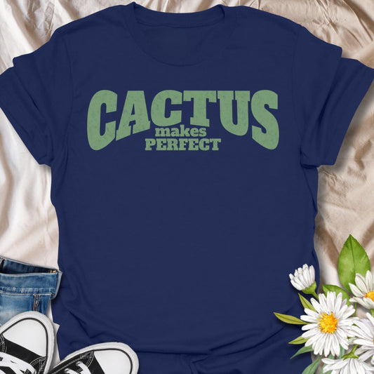 This Cactus Makes Perfect t-shirt is made for plant lovers who have a soft spot for prickly plants, desert greenery, and cute plant puns. Featuring bold vintage-style text in soft green with the phrase Cactus Makes Perfect, this simple design has a clean, funny botanical feel that is easy to wear every day. Perfect for cactus lovers, succulent fans, plant moms, plant dads, houseplant collectors, and anyone who thinks a little prickly personality is part of the charm.