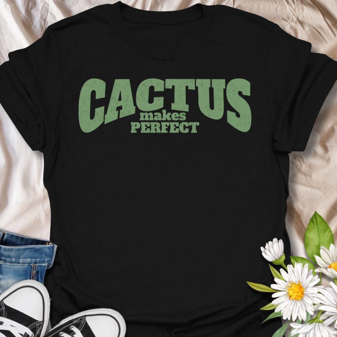 This Cactus Makes Perfect t-shirt is made for plant lovers who have a soft spot for prickly plants, desert greenery, and cute plant puns. Featuring bold vintage-style text in soft green with the phrase Cactus Makes Perfect, this simple design has a clean, funny botanical feel that is easy to wear every day. Perfect for cactus lovers, succulent fans, plant moms, plant dads, houseplant collectors, and anyone who thinks a little prickly personality is part of the charm.
