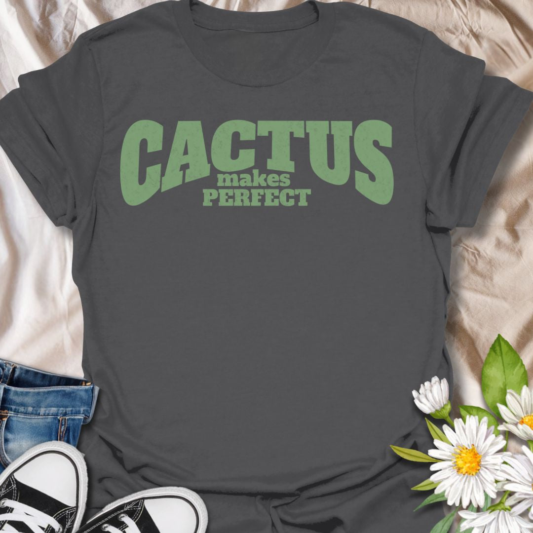 This Cactus Makes Perfect t-shirt is made for plant lovers who have a soft spot for prickly plants, desert greenery, and cute plant puns. Featuring bold vintage-style text in soft green with the phrase Cactus Makes Perfect, this simple design has a clean, funny botanical feel that is easy to wear every day. Perfect for cactus lovers, succulent fans, plant moms, plant dads, houseplant collectors, and anyone who thinks a little prickly personality is part of the charm.