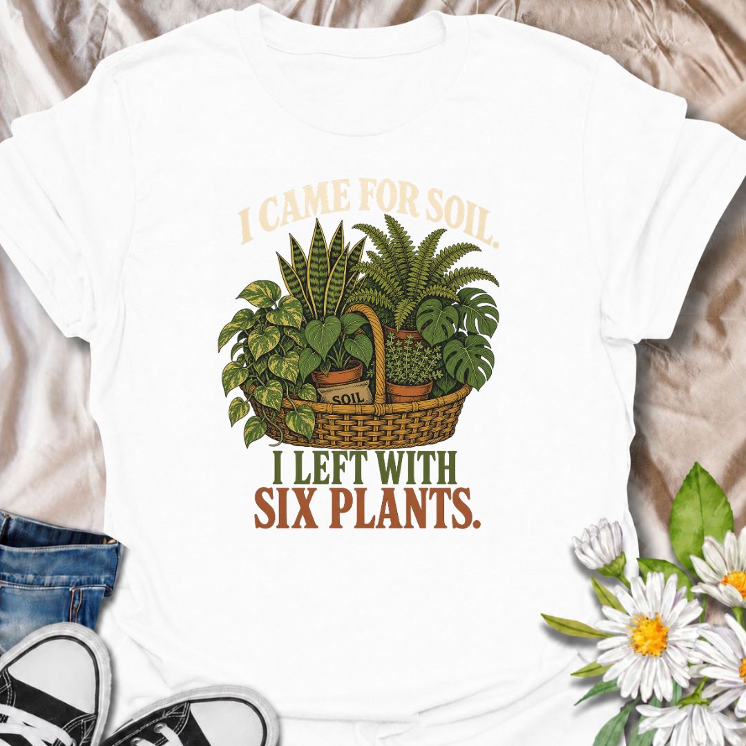 Funny houseplant T-shirt for plant lovers who visit the nursery for soil and leave with far more plants than planned. Featuring a vintage basket of lush houseplants and the line “I Came for Soil, I Left With Six Plants,” this is made for collectors who can never resist one more plant.