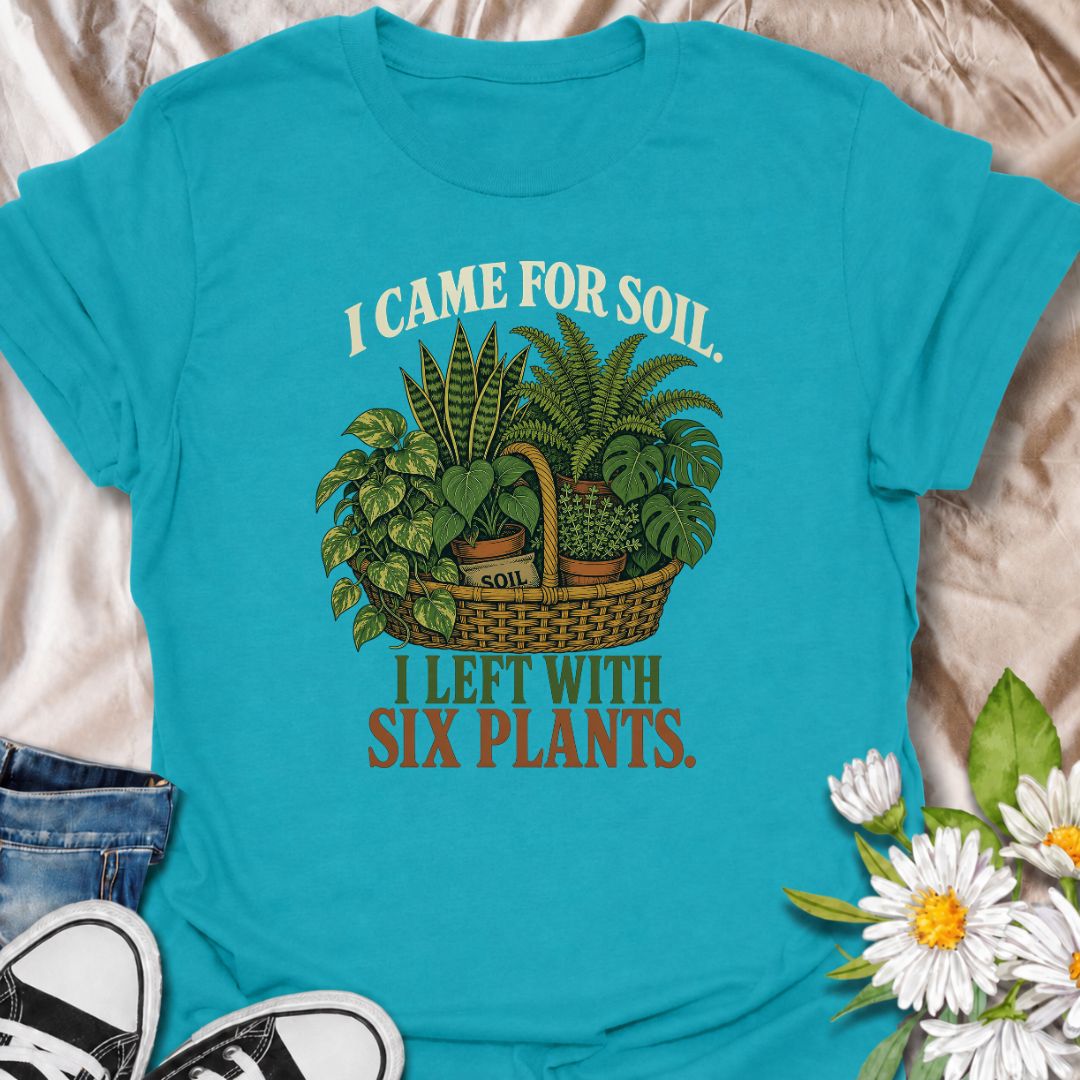 Funny houseplant T-shirt for plant lovers who visit the nursery for soil and leave with far more plants than planned. Featuring a vintage basket of lush houseplants and the line “I Came for Soil, I Left With Six Plants,” this is made for collectors who can never resist one more plant.
