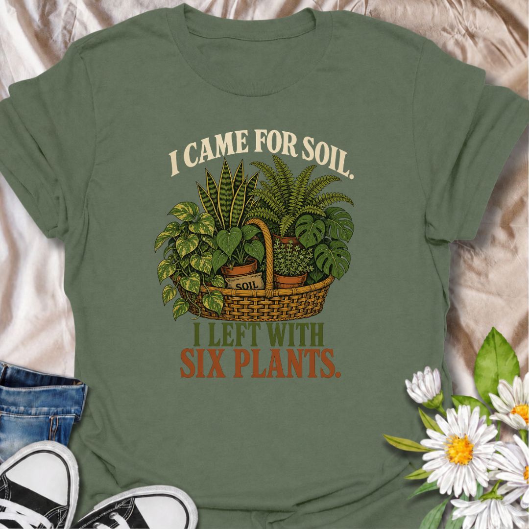 Funny houseplant T-shirt for plant lovers who visit the nursery for soil and leave with far more plants than planned. Featuring a vintage basket of lush houseplants and the line “I Came for Soil, I Left With Six Plants,” this is made for collectors who can never resist one more plant.