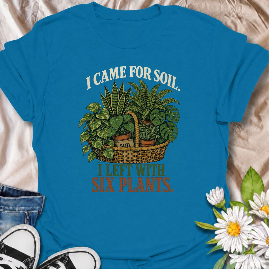 Funny houseplant T-shirt for plant lovers who visit the nursery for soil and leave with far more plants than planned. Featuring a vintage basket of lush houseplants and the line “I Came for Soil, I Left With Six Plants,” this is made for collectors who can never resist one more plant.