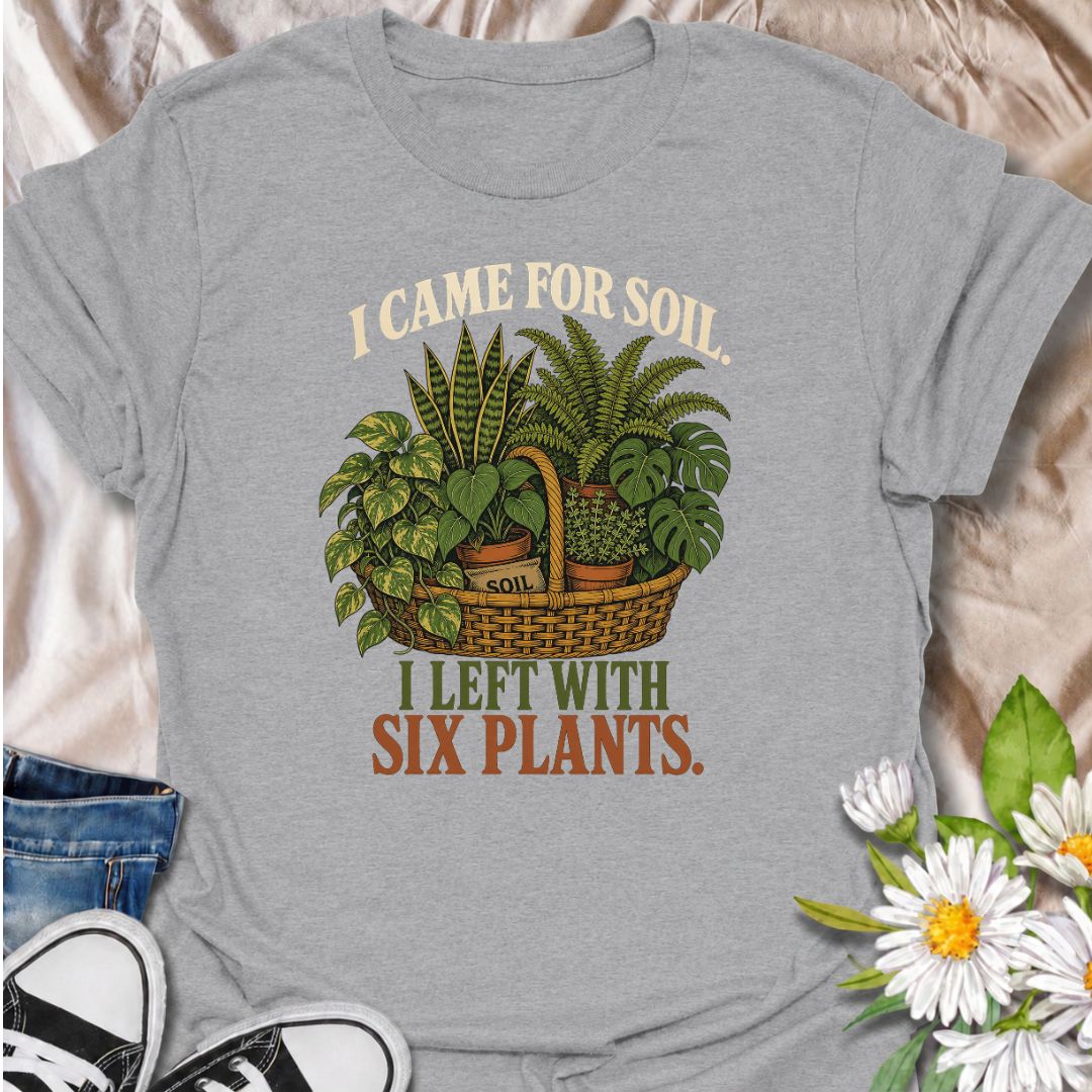 Funny houseplant T-shirt for plant lovers who visit the nursery for soil and leave with far more plants than planned. Featuring a vintage basket of lush houseplants and the line “I Came for Soil, I Left With Six Plants,” this is made for collectors who can never resist one more plant.