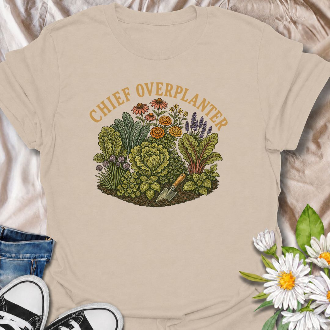 A funny gardening T-shirt for anyone who sees an empty patch of soil and immediately fills every inch of it. The “Chief Overplanter” phrase is perfect for enthusiastic gardeners who always squeeze in one more flower, herb, or vegetable. Featuring a lush garden bed packed with greenery and blooms, this design works especially well for cottage gardeners, backyard growers, and green-thumbed plant lovers. It makes a fun gift for gardeners who treat recommended spacing as more of a suggestion than a rule. Ideal 