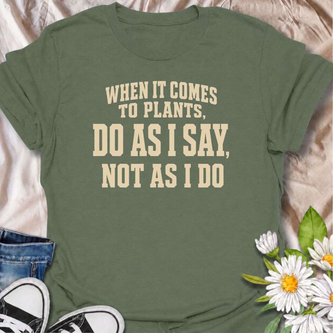 A funny plant T-shirt for anyone who gives excellent houseplant advice and then completely ignores it at home. The phrase “When It Comes to Plants, Do as I Say, Not as I Do” delivers dry, self-deprecating humor that experienced plant parents will recognize immediately. Perfect for houseplant collectors, indoor gardeners, and plant lovers whose own growing habits do not always match their expertise. The bold typography keeps the design clean, readable, and easy to wear. A great gift for plant enthusiasts, nu