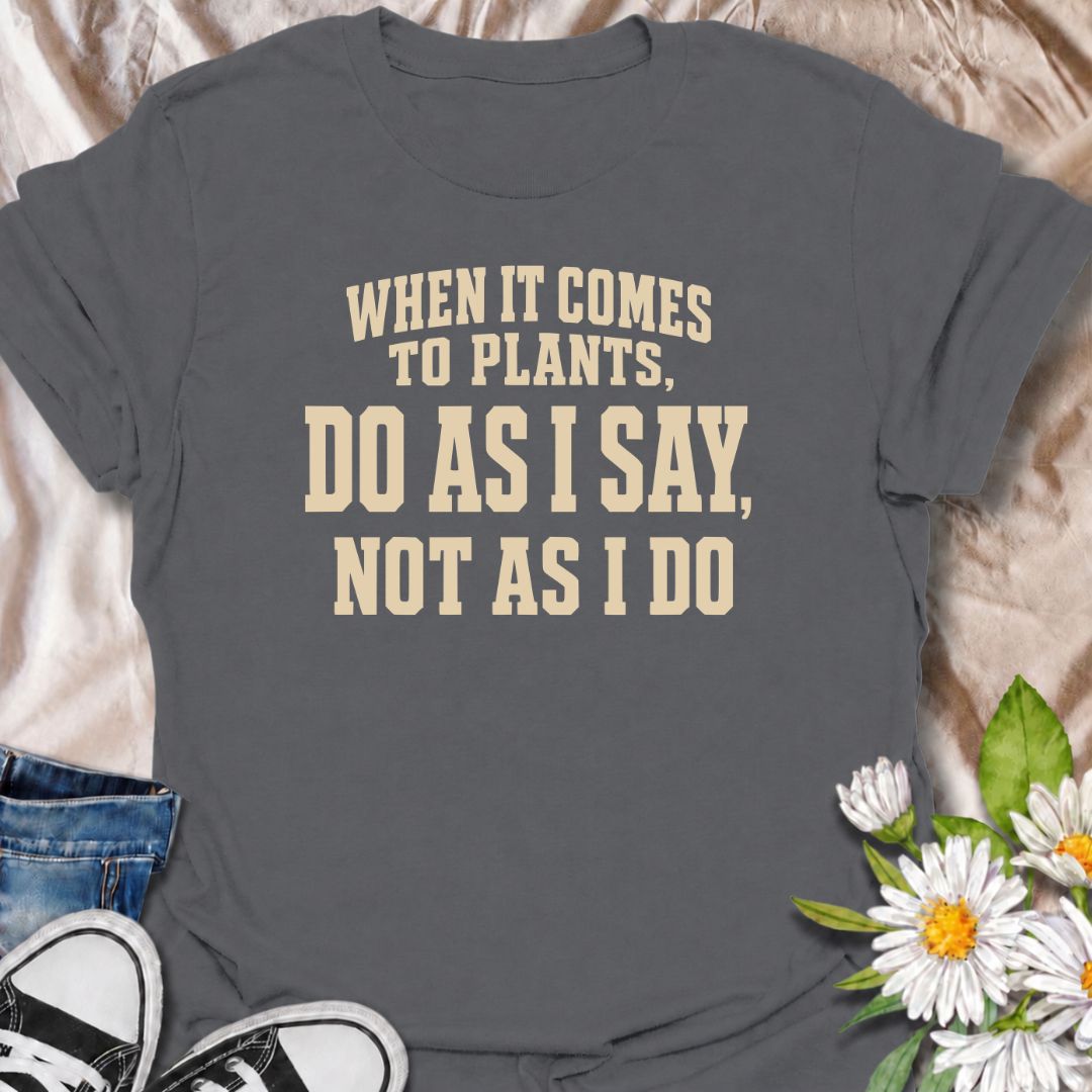 A funny plant T-shirt for anyone who gives excellent houseplant advice and then completely ignores it at home. The phrase “When It Comes to Plants, Do as I Say, Not as I Do” delivers dry, self-deprecating humor that experienced plant parents will recognize immediately. Perfect for houseplant collectors, indoor gardeners, and plant lovers whose own growing habits do not always match their expertise. The bold typography keeps the design clean, readable, and easy to wear. A great gift for plant enthusiasts, nu