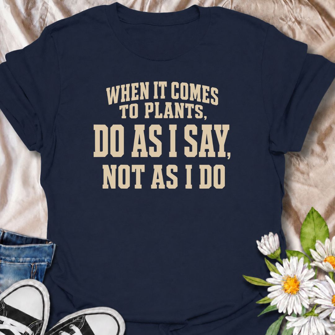 A funny plant T-shirt for anyone who gives excellent houseplant advice and then completely ignores it at home. The phrase “When It Comes to Plants, Do as I Say, Not as I Do” delivers dry, self-deprecating humor that experienced plant parents will recognize immediately. Perfect for houseplant collectors, indoor gardeners, and plant lovers whose own growing habits do not always match their expertise. The bold typography keeps the design clean, readable, and easy to wear. A great gift for plant enthusiasts, nu