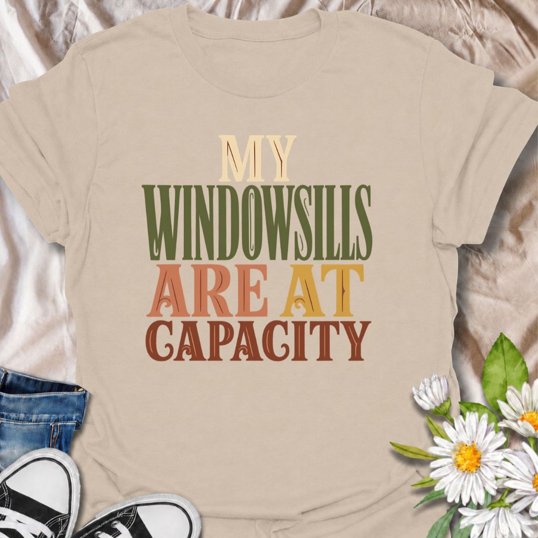 A funny plant T-shirt for anyone whose best windowsills are already completely claimed by houseplants. The phrase “My Windowsills Are at Capacity” is perfect for plant parents, indoor gardeners, and collectors who keep finding room for one more pot anyway. Its bold retro typography makes the design easy to read while keeping it simple and wearable. It makes a great gift for pothos lovers, houseplant collectors, and anyone with an ever-growing indoor jungle. Ideal for nursery trips, plant swaps, garden cente