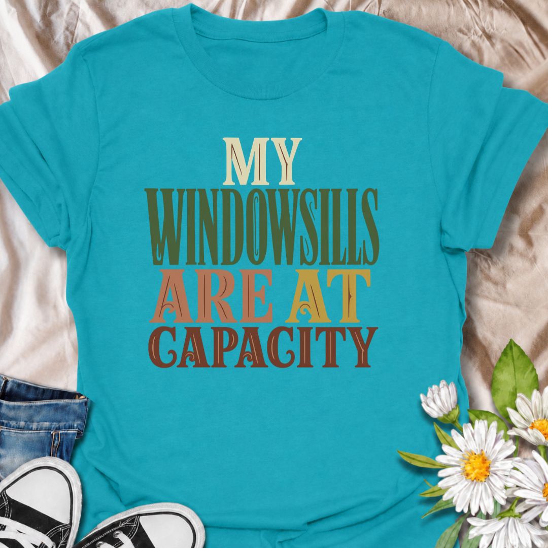 A funny plant T-shirt for anyone whose best windowsills are already completely claimed by houseplants. The phrase “My Windowsills Are at Capacity” is perfect for plant parents, indoor gardeners, and collectors who keep finding room for one more pot anyway. Its bold retro typography makes the design easy to read while keeping it simple and wearable. It makes a great gift for pothos lovers, houseplant collectors, and anyone with an ever-growing indoor jungle. Ideal for nursery trips, plant swaps, garden cente