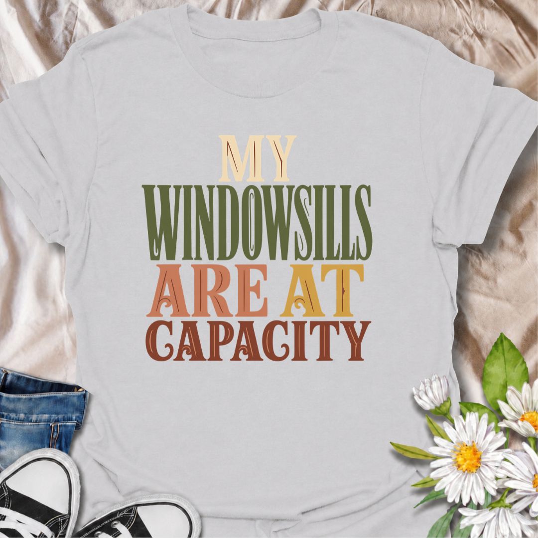 A funny plant T-shirt for anyone whose best windowsills are already completely claimed by houseplants. The phrase “My Windowsills Are at Capacity” is perfect for plant parents, indoor gardeners, and collectors who keep finding room for one more pot anyway. Its bold retro typography makes the design easy to read while keeping it simple and wearable. It makes a great gift for pothos lovers, houseplant collectors, and anyone with an ever-growing indoor jungle. Ideal for nursery trips, plant swaps, garden cente