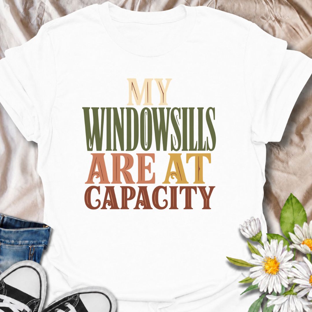 A funny plant T-shirt for anyone whose best windowsills are already completely claimed by houseplants. The phrase “My Windowsills Are at Capacity” is perfect for plant parents, indoor gardeners, and collectors who keep finding room for one more pot anyway. Its bold retro typography makes the design easy to read while keeping it simple and wearable. It makes a great gift for pothos lovers, houseplant collectors, and anyone with an ever-growing indoor jungle. Ideal for nursery trips, plant swaps, garden cente