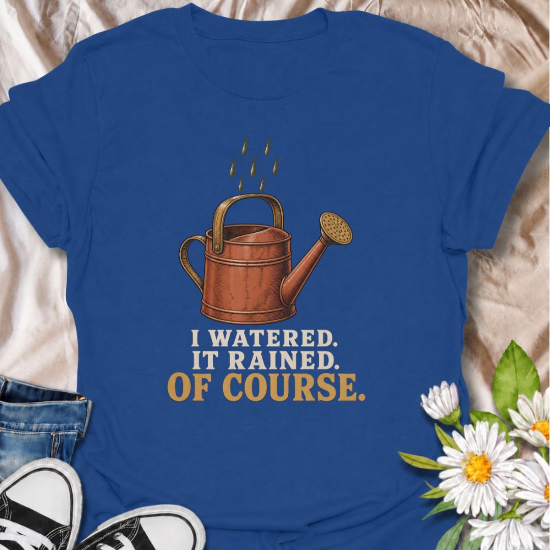 A funny gardening T-shirt for anyone who waters the garden just before the rain arrives. The phrase “I Watered. It Rained. Of Course.” captures one of those painfully familiar gardener moments with simple, dry humor. Featuring a vintage-style watering can and raindrops, this design is perfect for backyard gardeners, flower growers, and anyone who spends plenty of time checking the weather. It makes a great gift for gardeners who know nature rarely follows the plan. Ideal for garden days, nursery trips, farm