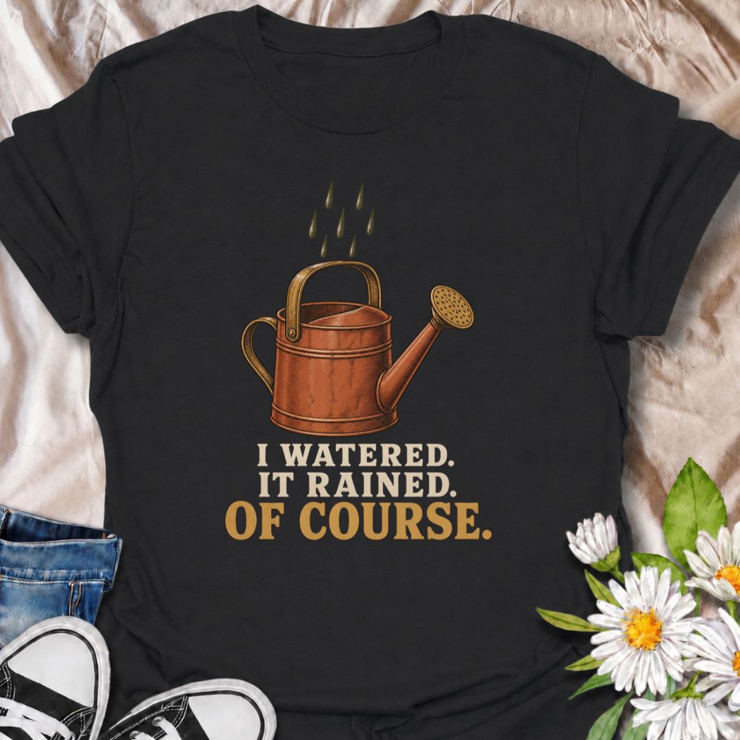 A funny gardening T-shirt for anyone who waters the garden just before the rain arrives. The phrase “I Watered. It Rained. Of Course.” captures one of those painfully familiar gardener moments with simple, dry humor. Featuring a vintage-style watering can and raindrops, this design is perfect for backyard gardeners, flower growers, and anyone who spends plenty of time checking the weather. It makes a great gift for gardeners who know nature rarely follows the plan. Ideal for garden days, nursery trips, farm
