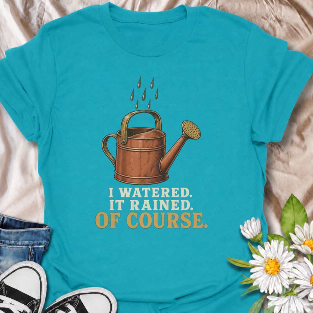 A funny gardening T-shirt for anyone who waters the garden just before the rain arrives. The phrase “I Watered. It Rained. Of Course.” captures one of those painfully familiar gardener moments with simple, dry humor. Featuring a vintage-style watering can and raindrops, this design is perfect for backyard gardeners, flower growers, and anyone who spends plenty of time checking the weather. It makes a great gift for gardeners who know nature rarely follows the plan. Ideal for garden days, nursery trips, farm