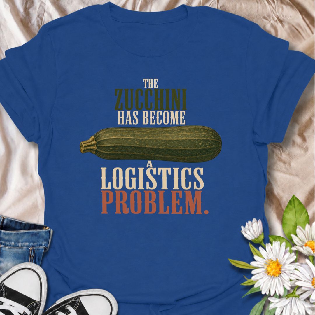 A funny gardening T-shirt for anyone who planted zucchini and then discovered just how productive one plant can be. The phrase “The Zucchini Has Become a Logistics Problem” perfectly captures that point in summer when the harvest starts taking over the kitchen. Featuring an oversized vintage-style zucchini, this design is ideal for vegetable gardeners, backyard growers, and anyone familiar with a bumper crop. It makes a great gift for gardeners who are forever giving away extra squash to friends and neighbo