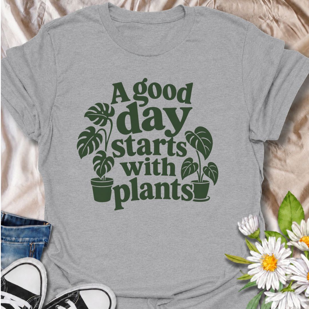 A cheerful plant T-shirt for anyone who believes the best days begin with a little greenery. The phrase “A Good Day Starts With Plants” pairs perfectly with the simple monstera-inspired artwork for a clean, easy-to-wear botanical look. It’s ideal for houseplant lovers, plant parents, indoor gardeners, and anyone who feels better surrounded by leaves. This design makes a lovely gift for plant collectors, nursery regulars, and lovers of cozy indoor jungles. Perfect for everyday wear, plant shopping, greenhous
