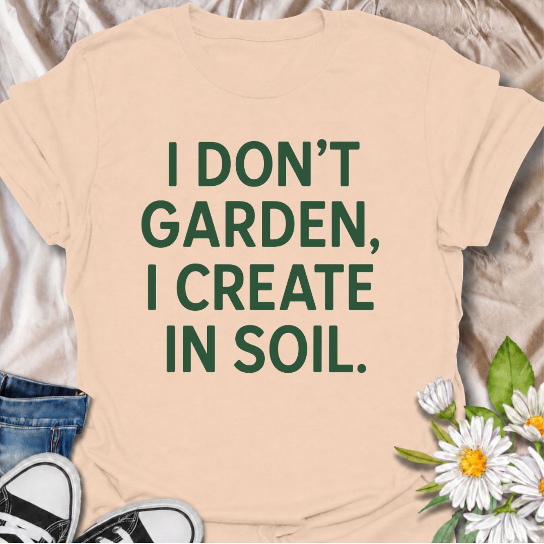 A bold gardening T-shirt for anyone who sees the garden as a place to make, experiment, and grow. The phrase “I Don’t Garden, I Create in Soil” gives gardening a more creative, expressive twist while keeping the design clean and modern. It is perfect for gardeners, plant lovers, backyard growers, and anyone who treats planting as their favorite form of creativity. The simple typography makes it easy to wear and easy to pair with everyday outfits. A great gift for gardeners who see soil as their canvas.