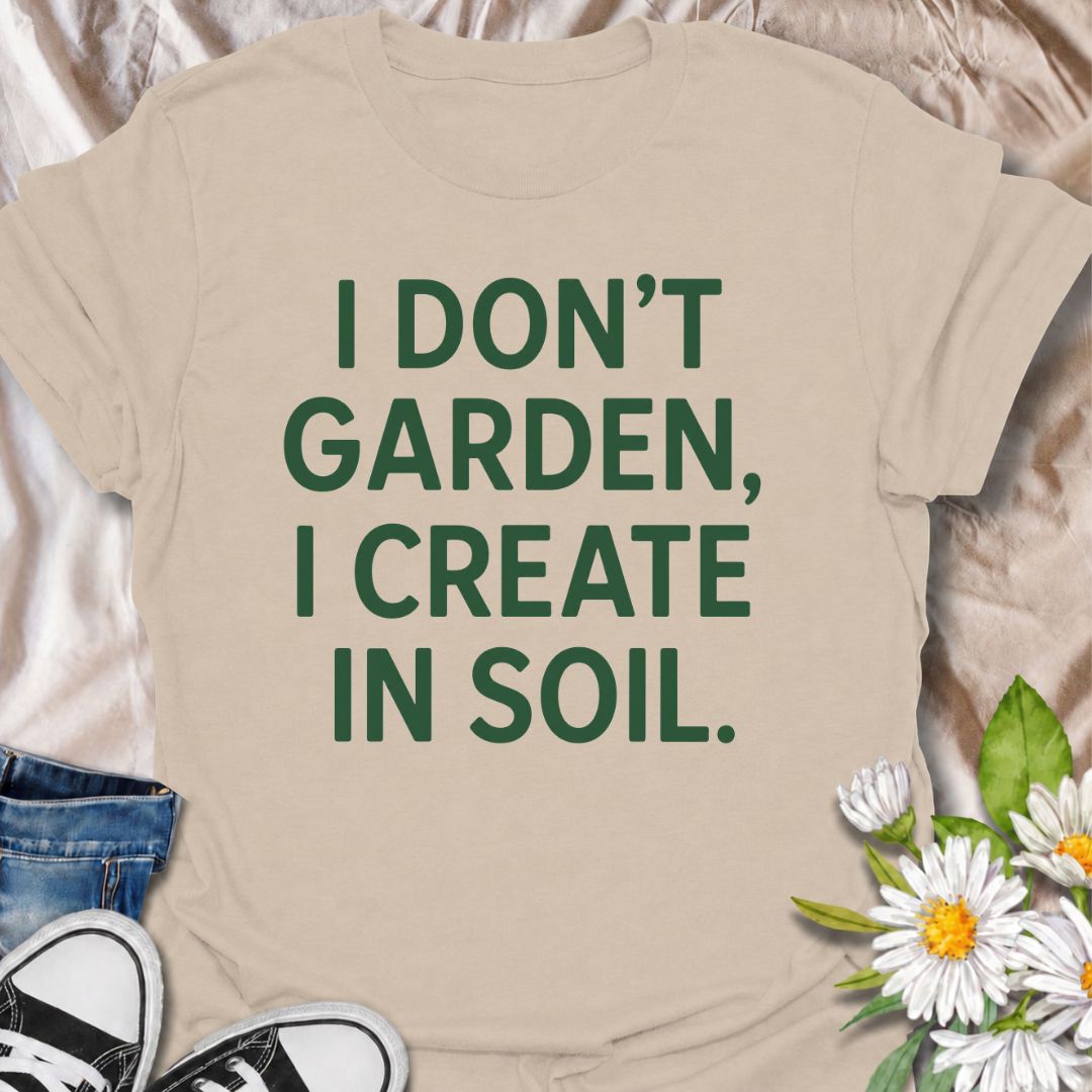 A bold gardening T-shirt for anyone who sees the garden as a place to make, experiment, and grow. The phrase “I Don’t Garden, I Create in Soil” gives gardening a more creative, expressive twist while keeping the design clean and modern. It is perfect for gardeners, plant lovers, backyard growers, and anyone who treats planting as their favorite form of creativity. The simple typography makes it easy to wear and easy to pair with everyday outfits. A great gift for gardeners who see soil as their canvas.