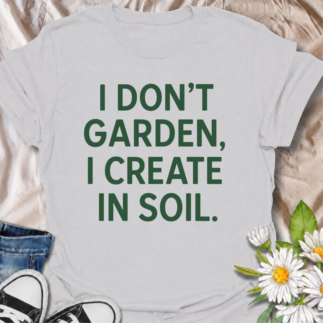 A bold gardening T-shirt for anyone who sees the garden as a place to make, experiment, and grow. The phrase “I Don’t Garden, I Create in Soil” gives gardening a more creative, expressive twist while keeping the design clean and modern. It is perfect for gardeners, plant lovers, backyard growers, and anyone who treats planting as their favorite form of creativity. The simple typography makes it easy to wear and easy to pair with everyday outfits. A great gift for gardeners who see soil as their canvas.