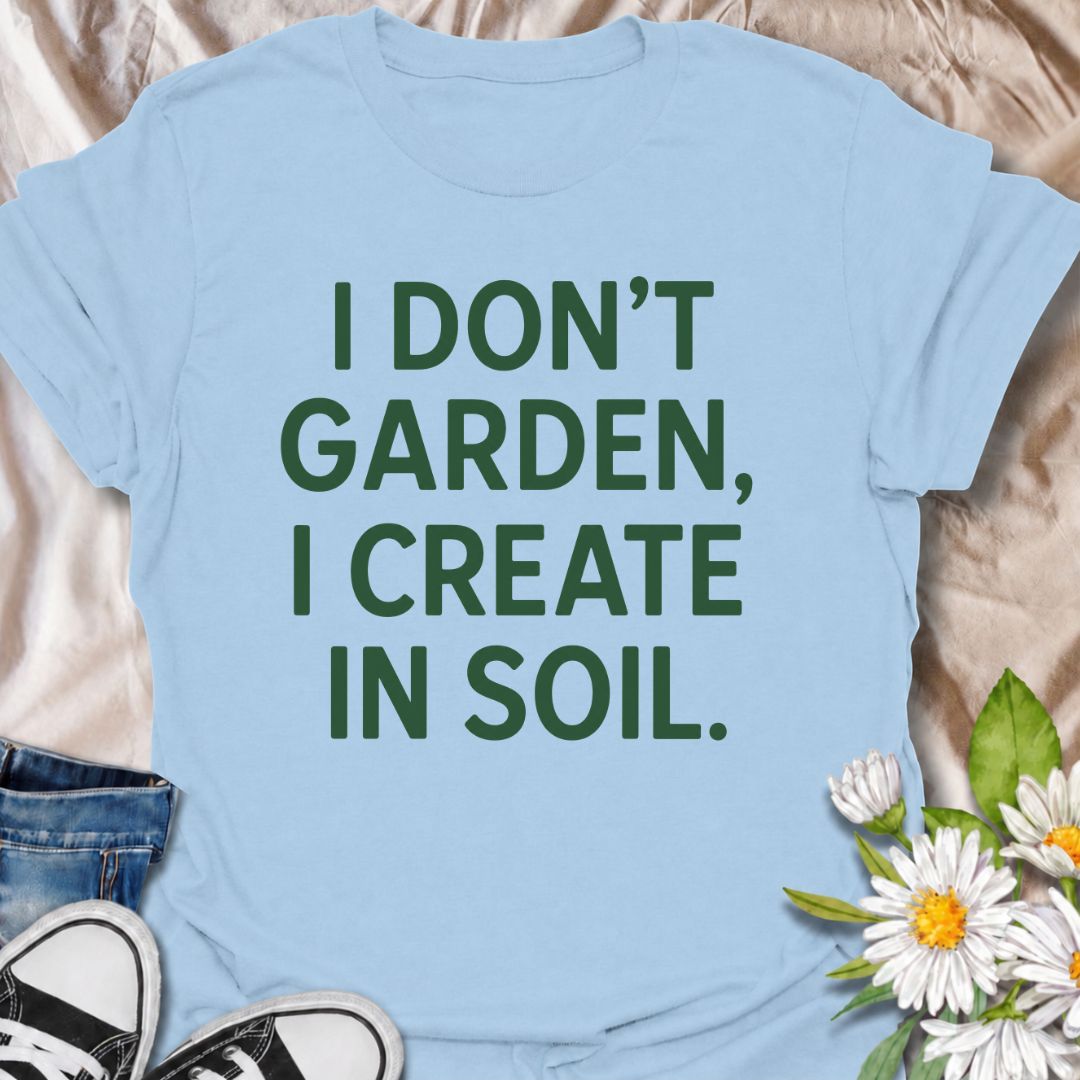 A bold gardening T-shirt for anyone who sees the garden as a place to make, experiment, and grow. The phrase “I Don’t Garden, I Create in Soil” gives gardening a more creative, expressive twist while keeping the design clean and modern. It is perfect for gardeners, plant lovers, backyard growers, and anyone who treats planting as their favorite form of creativity. The simple typography makes it easy to wear and easy to pair with everyday outfits. A great gift for gardeners who see soil as their canvas.