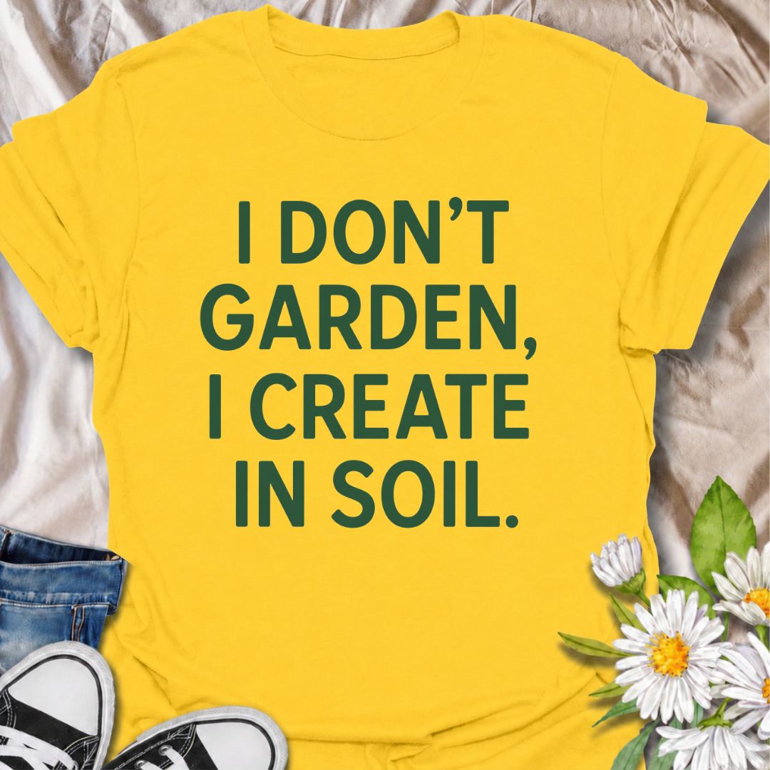 A bold gardening T-shirt for anyone who sees the garden as a place to make, experiment, and grow. The phrase “I Don’t Garden, I Create in Soil” gives gardening a more creative, expressive twist while keeping the design clean and modern. It is perfect for gardeners, plant lovers, backyard growers, and anyone who treats planting as their favorite form of creativity. The simple typography makes it easy to wear and easy to pair with everyday outfits. A great gift for gardeners who see soil as their canvas.