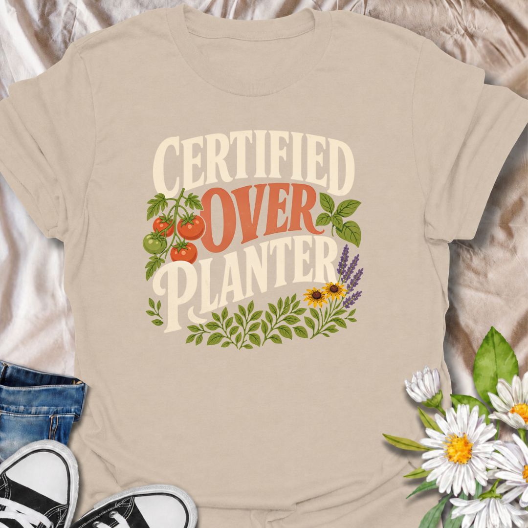 A funny gardening T-shirt for anyone who believes recommended spacing is more of a suggestion than a rule. The bold “Certified Overplanter” phrase is paired with tomatoes, herbs, flowers, and leafy greenery for a colorful garden-lover design. It is perfect for vegetable gardeners, cottage gardeners, backyard growers, and anyone who always squeezes in one more plant. The design makes a great gift for gardeners who proudly embrace a full, abundant garden. Ideal for garden days, nursery trips, farmers markets,