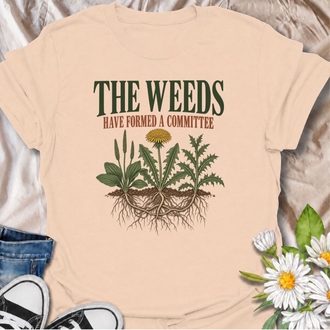 A funny gardening T-shirt for anyone who knows the weeds are never working alone. The phrase “The Weeds Have Formed a Committee” turns a familiar gardening frustration into dry, relatable humor. Featuring a cluster of weeds with tangled roots, this design is perfect for backyard gardeners, allotment growers, and anyone who spends more time weeding than planned. It makes a great gift for gardeners who appreciate clever garden humor and know just how persistent weeds can be. Ideal for garden days, nursery tri