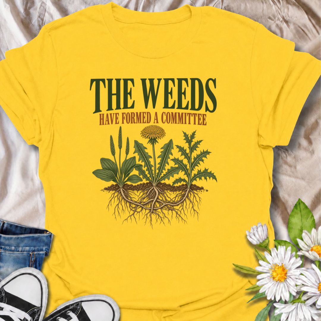 A funny gardening T-shirt for anyone who knows the weeds are never working alone. The phrase “The Weeds Have Formed a Committee” turns a familiar gardening frustration into dry, relatable humor. Featuring a cluster of weeds with tangled roots, this design is perfect for backyard gardeners, allotment growers, and anyone who spends more time weeding than planned. It makes a great gift for gardeners who appreciate clever garden humor and know just how persistent weeds can be. Ideal for garden days, nursery tri