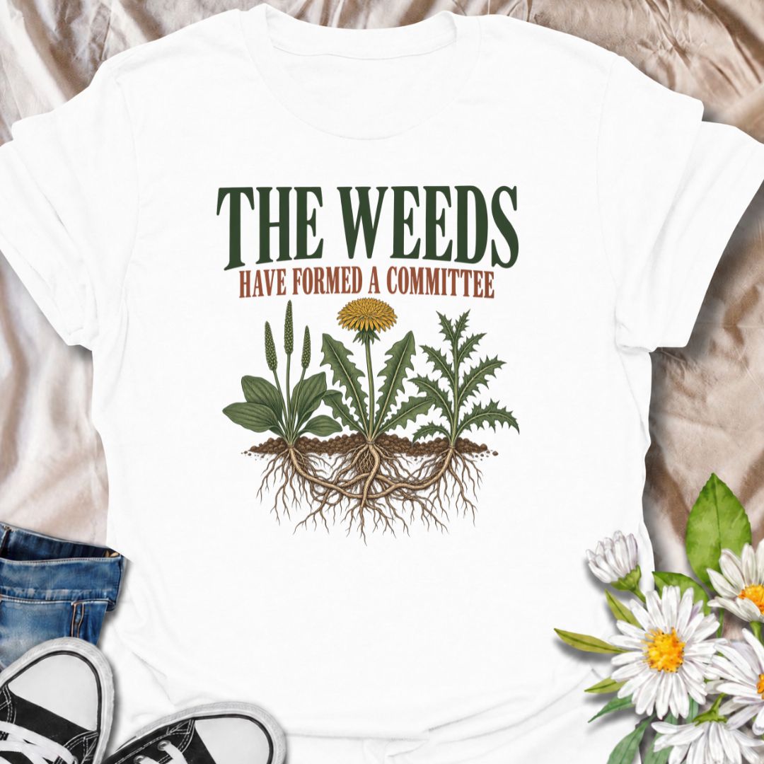A funny gardening T-shirt for anyone who knows the weeds are never working alone. The phrase “The Weeds Have Formed a Committee” turns a familiar gardening frustration into dry, relatable humor. Featuring a cluster of weeds with tangled roots, this design is perfect for backyard gardeners, allotment growers, and anyone who spends more time weeding than planned. It makes a great gift for gardeners who appreciate clever garden humor and know just how persistent weeds can be. Ideal for garden days, nursery tri