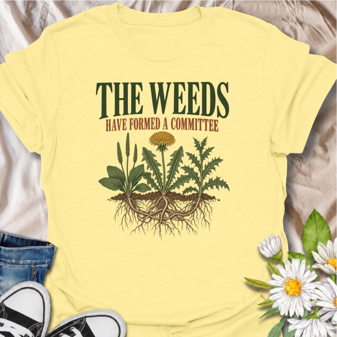A funny gardening T-shirt for anyone who knows the weeds are never working alone. The phrase “The Weeds Have Formed a Committee” turns a familiar gardening frustration into dry, relatable humor. Featuring a cluster of weeds with tangled roots, this design is perfect for backyard gardeners, allotment growers, and anyone who spends more time weeding than planned. It makes a great gift for gardeners who appreciate clever garden humor and know just how persistent weeds can be. Ideal for garden days, nursery tri
