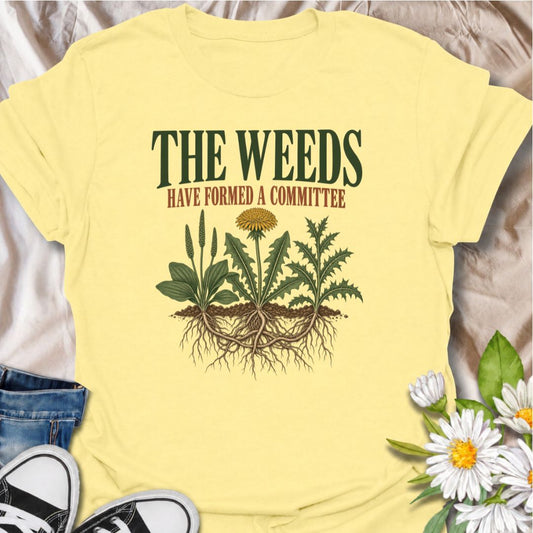 A funny gardening T-shirt for anyone who knows the weeds are never working alone. The phrase “The Weeds Have Formed a Committee” turns a familiar gardening frustration into dry, relatable humor. Featuring a cluster of weeds with tangled roots, this design is perfect for backyard gardeners, allotment growers, and anyone who spends more time weeding than planned. It makes a great gift for gardeners who appreciate clever garden humor and know just how persistent weeds can be. Ideal for garden days, nursery tri