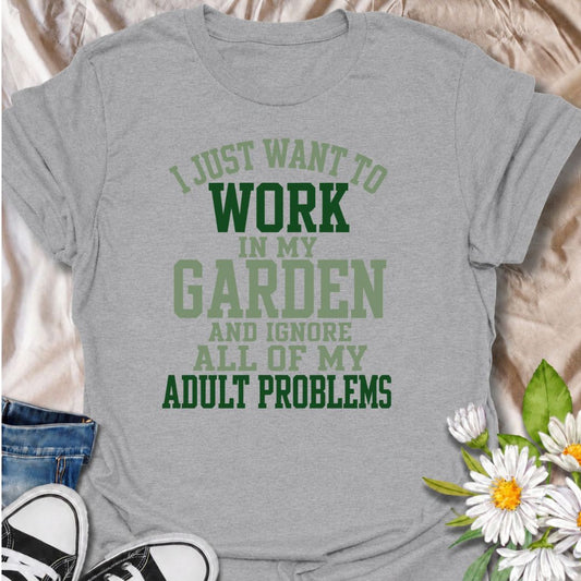 A funny gardening T-shirt for anyone who would rather spend the day outside with plants than deal with everyday responsibilities. The phrase “I Just Want to Work in My Garden and Ignore All of My Adult Problems” delivers relatable garden humor with a bold, easy-to-read layout. It is perfect for backyard gardeners, flower growers, vegetable gardeners, and anyone who treats gardening as their favorite escape. The design makes a fun gift for gardeners who would happily swap chores and errands for a few more ho