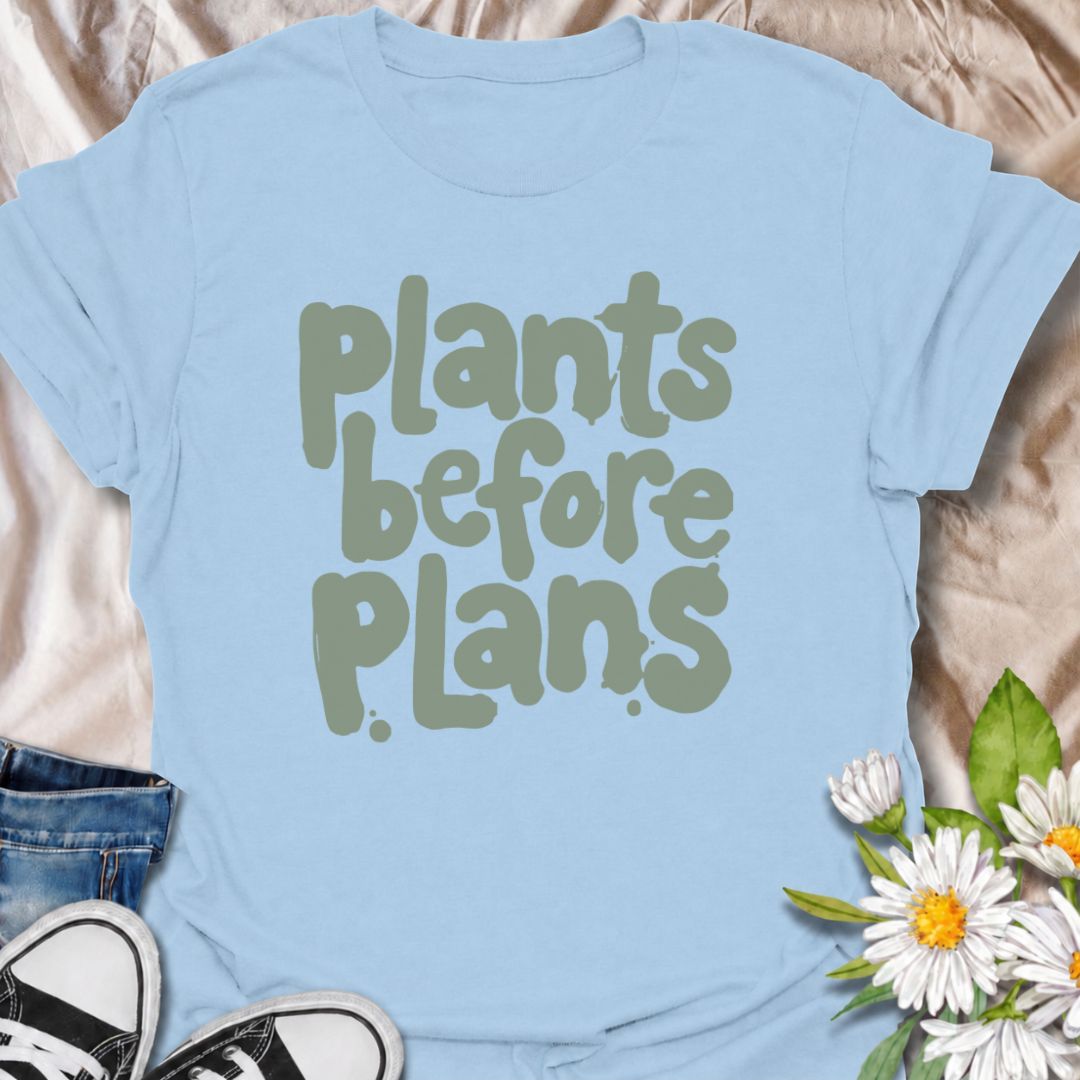 A funny plant T-shirt for anyone whose priorities are clear: plants first, plans later. The phrase “Plants Before Plans” is simple, playful, and instantly relatable for houseplant lovers, plant parents, and indoor gardeners. Its chunky retro typography gives the design a casual, modern feel that is easy to wear. It makes a great gift for plant collectors, nursery regulars, and anyone who would happily cancel plans for a quiet day with their plants. Perfect for plant shopping, greenhouse visits, relaxed week