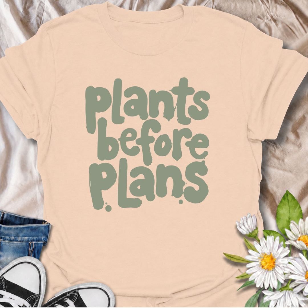 A funny plant T-shirt for anyone whose priorities are clear: plants first, plans later. The phrase “Plants Before Plans” is simple, playful, and instantly relatable for houseplant lovers, plant parents, and indoor gardeners. Its chunky retro typography gives the design a casual, modern feel that is easy to wear. It makes a great gift for plant collectors, nursery regulars, and anyone who would happily cancel plans for a quiet day with their plants. Perfect for plant shopping, greenhouse visits, relaxed week