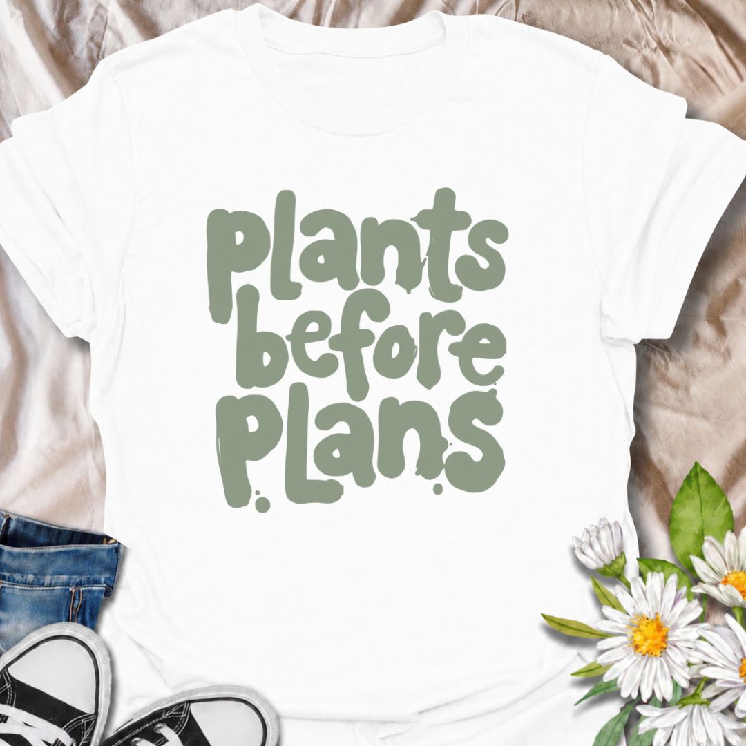 A funny plant T-shirt for anyone whose priorities are clear: plants first, plans later. The phrase “Plants Before Plans” is simple, playful, and instantly relatable for houseplant lovers, plant parents, and indoor gardeners. Its chunky retro typography gives the design a casual, modern feel that is easy to wear. It makes a great gift for plant collectors, nursery regulars, and anyone who would happily cancel plans for a quiet day with their plants. Perfect for plant shopping, greenhouse visits, relaxed week