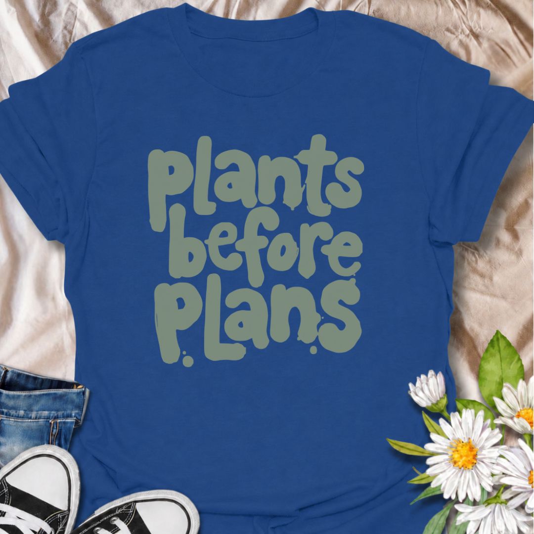 A funny plant T-shirt for anyone whose priorities are clear: plants first, plans later. The phrase “Plants Before Plans” is simple, playful, and instantly relatable for houseplant lovers, plant parents, and indoor gardeners. Its chunky retro typography gives the design a casual, modern feel that is easy to wear. It makes a great gift for plant collectors, nursery regulars, and anyone who would happily cancel plans for a quiet day with their plants. Perfect for plant shopping, greenhouse visits, relaxed week
