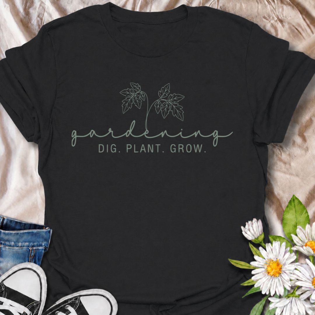 A simple gardening T-shirt for anyone who feels most at home with their hands in the soil. The understated “Gardening — Dig. Plant. Grow.” design combines delicate botanical line art with a clean, relaxed look. It is perfect for gardeners, plant lovers, backyard growers, and anyone who enjoys the quiet rhythm of planting and growing. The softer style makes it especially easy to wear while still clearly speaking to the gardening niche. A lovely gift for flower gardeners, vegetable growers, and anyone who wou
