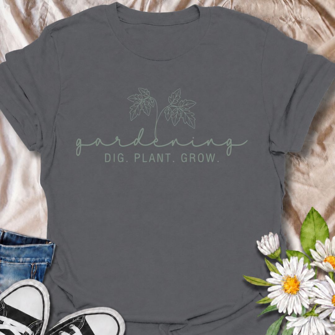 A simple gardening T-shirt for anyone who feels most at home with their hands in the soil. The understated “Gardening — Dig. Plant. Grow.” design combines delicate botanical line art with a clean, relaxed look. It is perfect for gardeners, plant lovers, backyard growers, and anyone who enjoys the quiet rhythm of planting and growing. The softer style makes it especially easy to wear while still clearly speaking to the gardening niche. A lovely gift for flower gardeners, vegetable growers, and anyone who wou