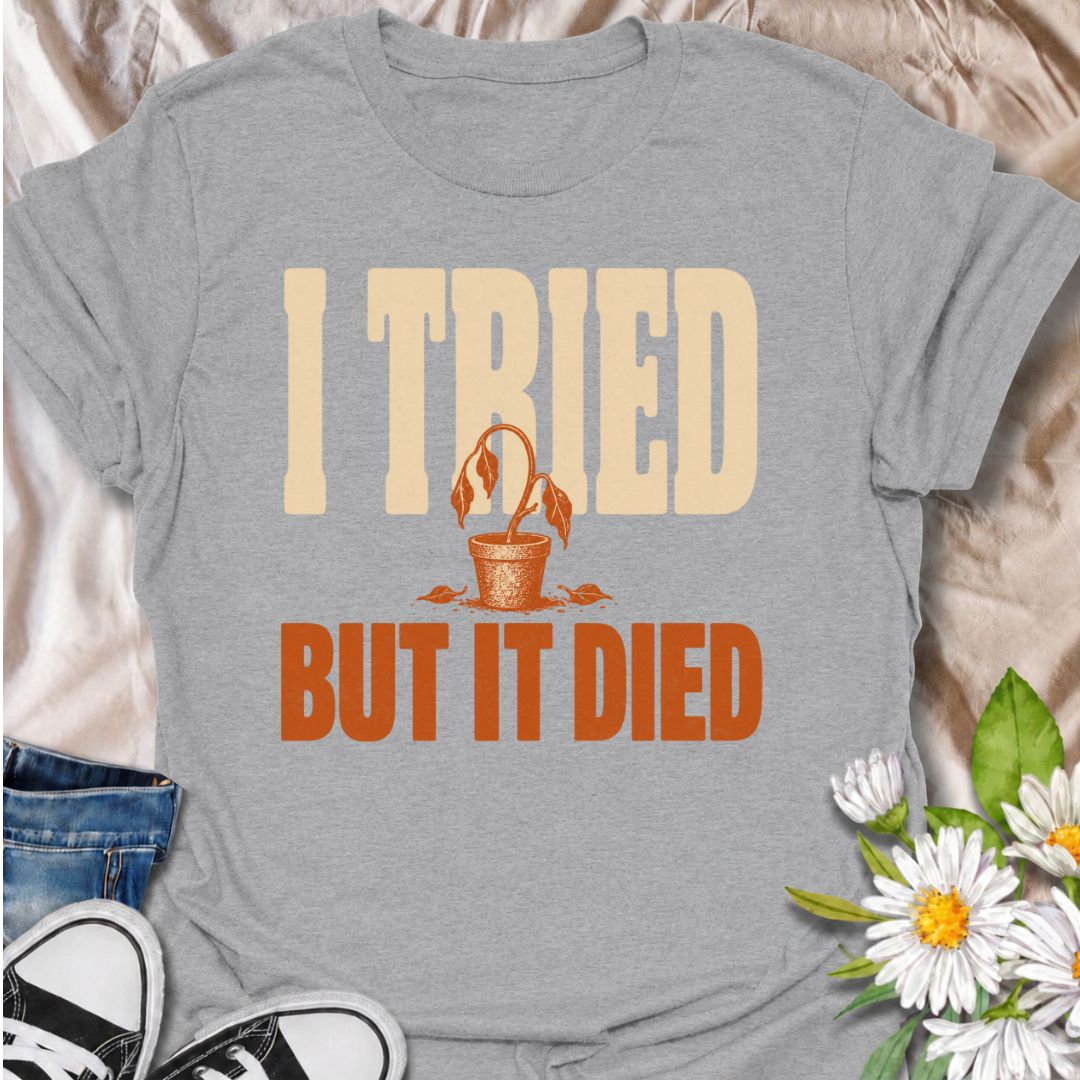 A funny plant T-shirt for anyone who gave it their best shot and still ended up with a very unhappy houseplant. The phrase “I Tried But It Died” delivers simple, self-deprecating plant humor that new growers and experienced plant parents alike will recognize. Featuring a wilted potted plant, the design keeps the joke bold, clear, and easy to wear. It makes a great gift for houseplant lovers, accidental plant killers, and anyone whose green thumb is still a work in progress. Ideal for nursery trips, plant sw