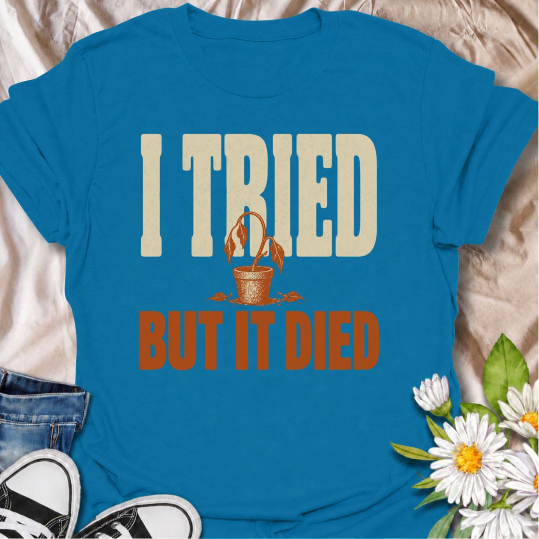 A funny plant T-shirt for anyone who gave it their best shot and still ended up with a very unhappy houseplant. The phrase “I Tried But It Died” delivers simple, self-deprecating plant humor that new growers and experienced plant parents alike will recognize. Featuring a wilted potted plant, the design keeps the joke bold, clear, and easy to wear. It makes a great gift for houseplant lovers, accidental plant killers, and anyone whose green thumb is still a work in progress. Ideal for nursery trips, plant sw