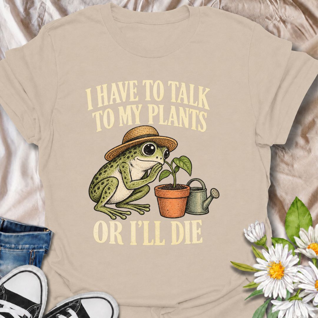 A funny plant T-shirt for anyone who takes conversations with their houseplants very seriously. Featuring a wide-eyed frog in a garden hat leaning in toward a potted plant, this design gives the phrase “I Have to Talk to My Plants or I’ll Die” a playful, slightly absurd feel. It is perfect for plant parents, houseplant lovers, indoor gardeners, and anyone who treats their plants like part of the family. The design makes a fun gift for frog lovers, plant collectors, and people with an ever-growing indoor jun