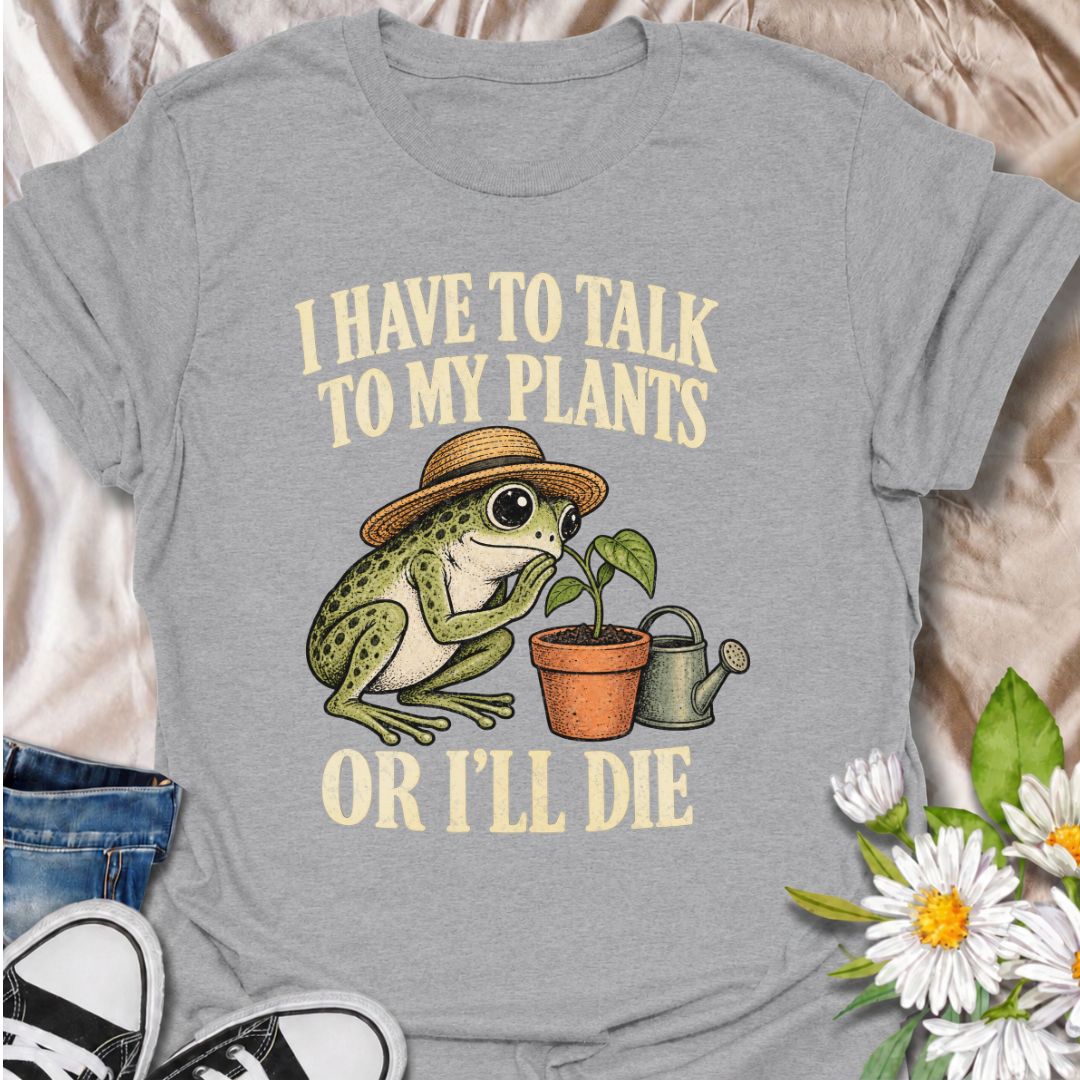 A funny plant T-shirt for anyone who takes conversations with their houseplants very seriously. Featuring a wide-eyed frog in a garden hat leaning in toward a potted plant, this design gives the phrase “I Have to Talk to My Plants or I’ll Die” a playful, slightly absurd feel. It is perfect for plant parents, houseplant lovers, indoor gardeners, and anyone who treats their plants like part of the family. The design makes a fun gift for frog lovers, plant collectors, and people with an ever-growing indoor jun