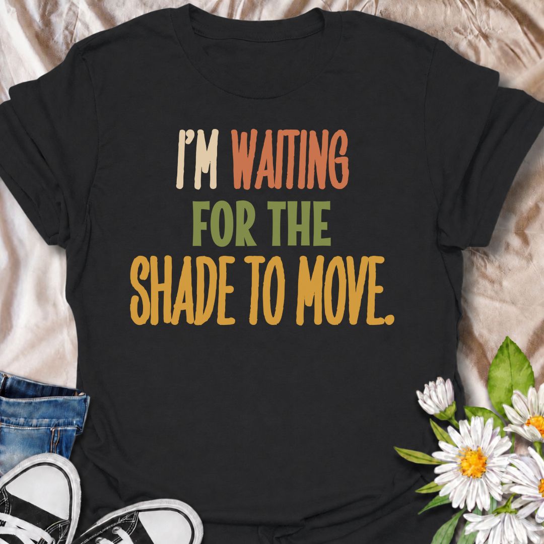 A funny gardening T-shirt for anyone who knows a “quick job” in the garden can turn into a full afternoon outside. The phrase “I’m Waiting for the Shade to Move” captures that familiar gardener habit of working around the sun instead of calling it a day. Its bold retro typography keeps the design simple, readable, and easy to wear. It makes a great gift for backyard gardeners, flower growers, vegetable gardeners, and anyone who plans garden jobs around the heat. Ideal for garden days, nursery trips, farmers