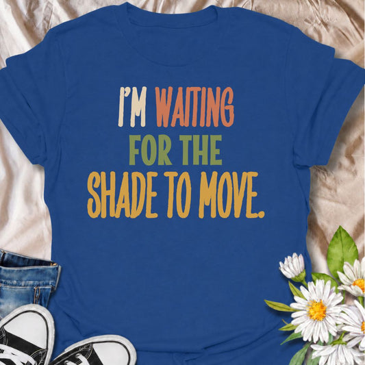 A funny gardening T-shirt for anyone who knows a “quick job” in the garden can turn into a full afternoon outside. The phrase “I’m Waiting for the Shade to Move” captures that familiar gardener habit of working around the sun instead of calling it a day. Its bold retro typography keeps the design simple, readable, and easy to wear. It makes a great gift for backyard gardeners, flower growers, vegetable gardeners, and anyone who plans garden jobs around the heat. Ideal for garden days, nursery trips, farmers