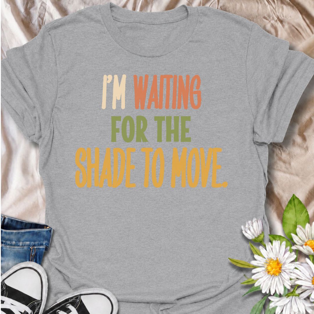 A funny gardening T-shirt for anyone who knows a “quick job” in the garden can turn into a full afternoon outside. The phrase “I’m Waiting for the Shade to Move” captures that familiar gardener habit of working around the sun instead of calling it a day. Its bold retro typography keeps the design simple, readable, and easy to wear. It makes a great gift for backyard gardeners, flower growers, vegetable gardeners, and anyone who plans garden jobs around the heat. Ideal for garden days, nursery trips, farmers