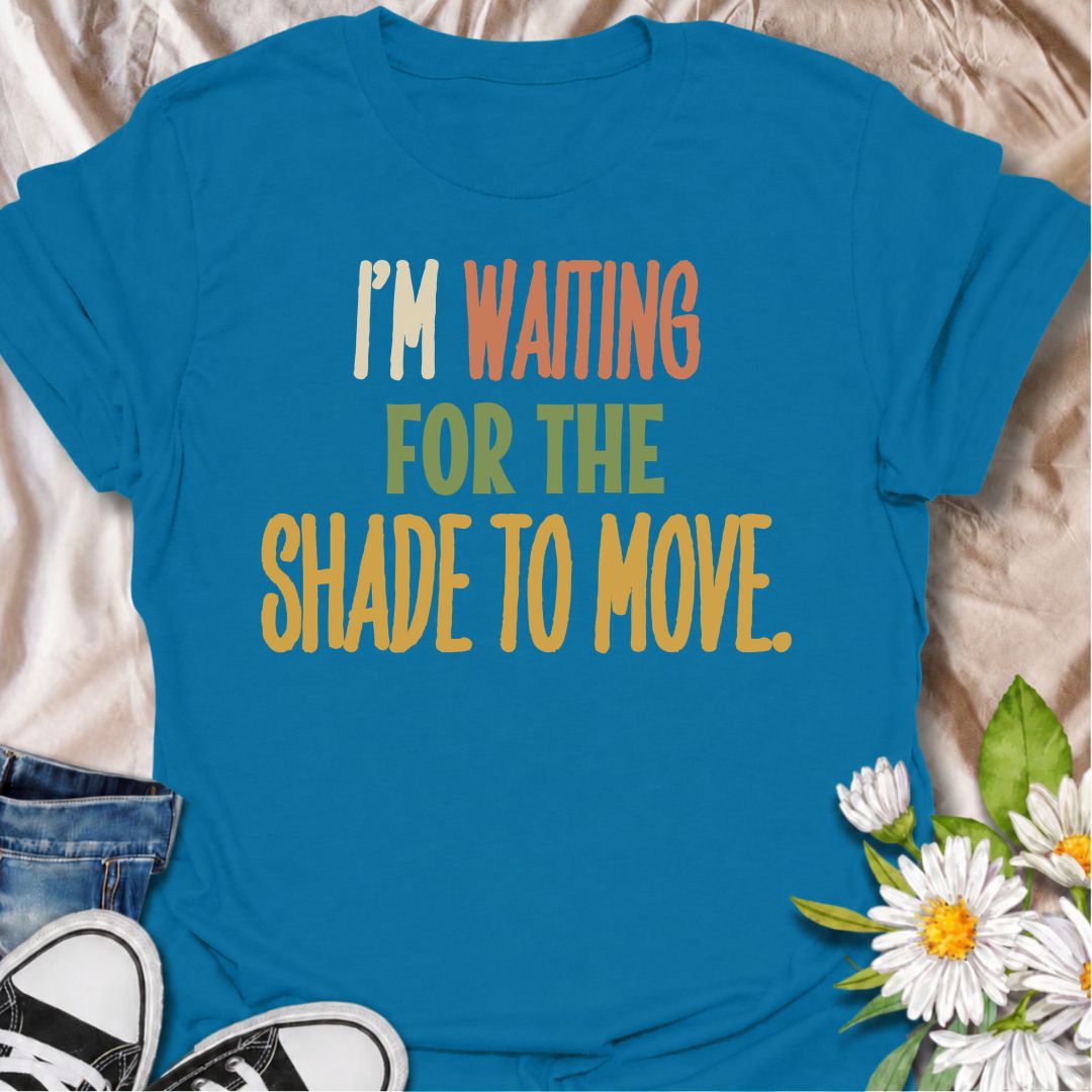 A funny gardening T-shirt for anyone who knows a “quick job” in the garden can turn into a full afternoon outside. The phrase “I’m Waiting for the Shade to Move” captures that familiar gardener habit of working around the sun instead of calling it a day. Its bold retro typography keeps the design simple, readable, and easy to wear. It makes a great gift for backyard gardeners, flower growers, vegetable gardeners, and anyone who plans garden jobs around the heat. Ideal for garden days, nursery trips, farmers