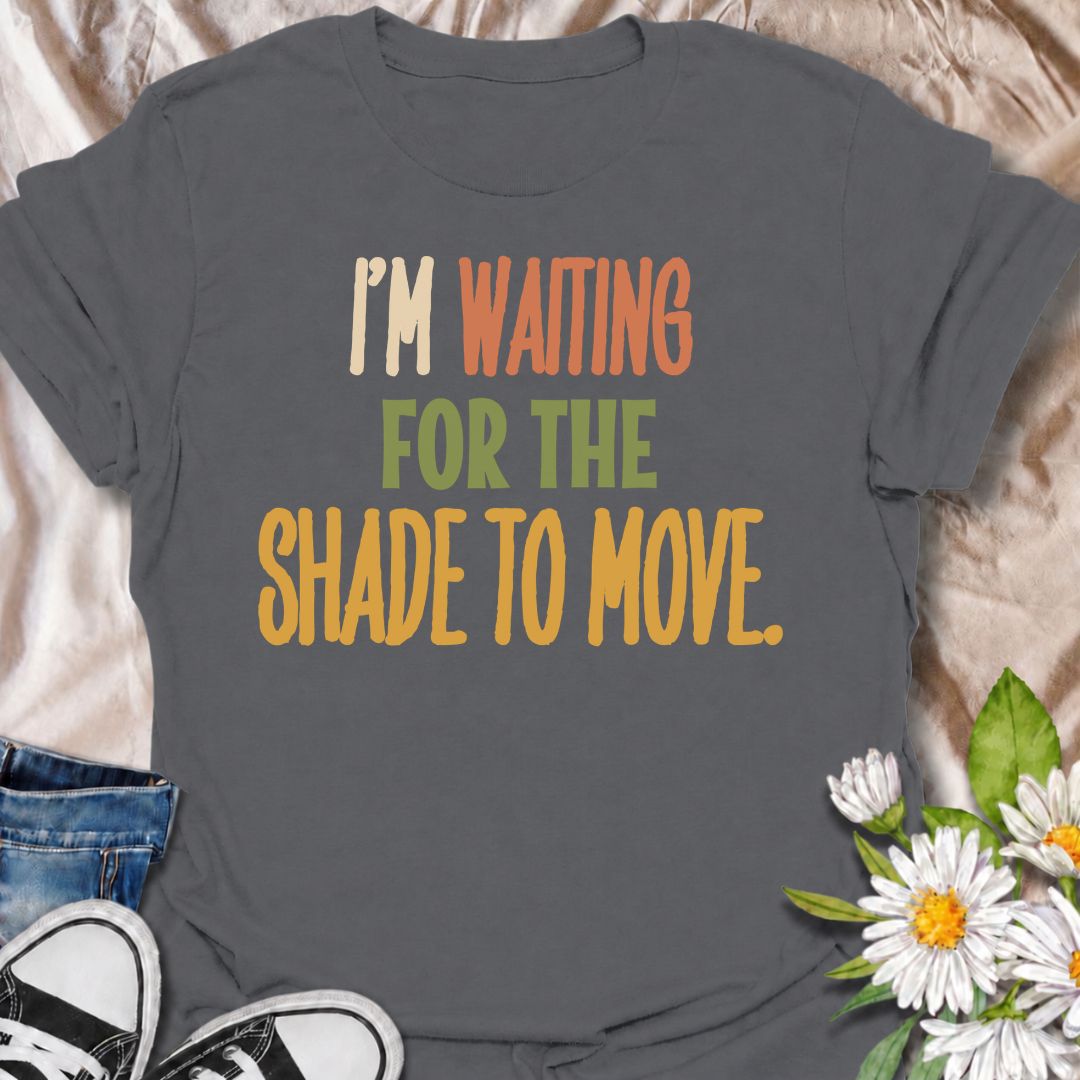A funny gardening T-shirt for anyone who knows a “quick job” in the garden can turn into a full afternoon outside. The phrase “I’m Waiting for the Shade to Move” captures that familiar gardener habit of working around the sun instead of calling it a day. Its bold retro typography keeps the design simple, readable, and easy to wear. It makes a great gift for backyard gardeners, flower growers, vegetable gardeners, and anyone who plans garden jobs around the heat. Ideal for garden days, nursery trips, farmers