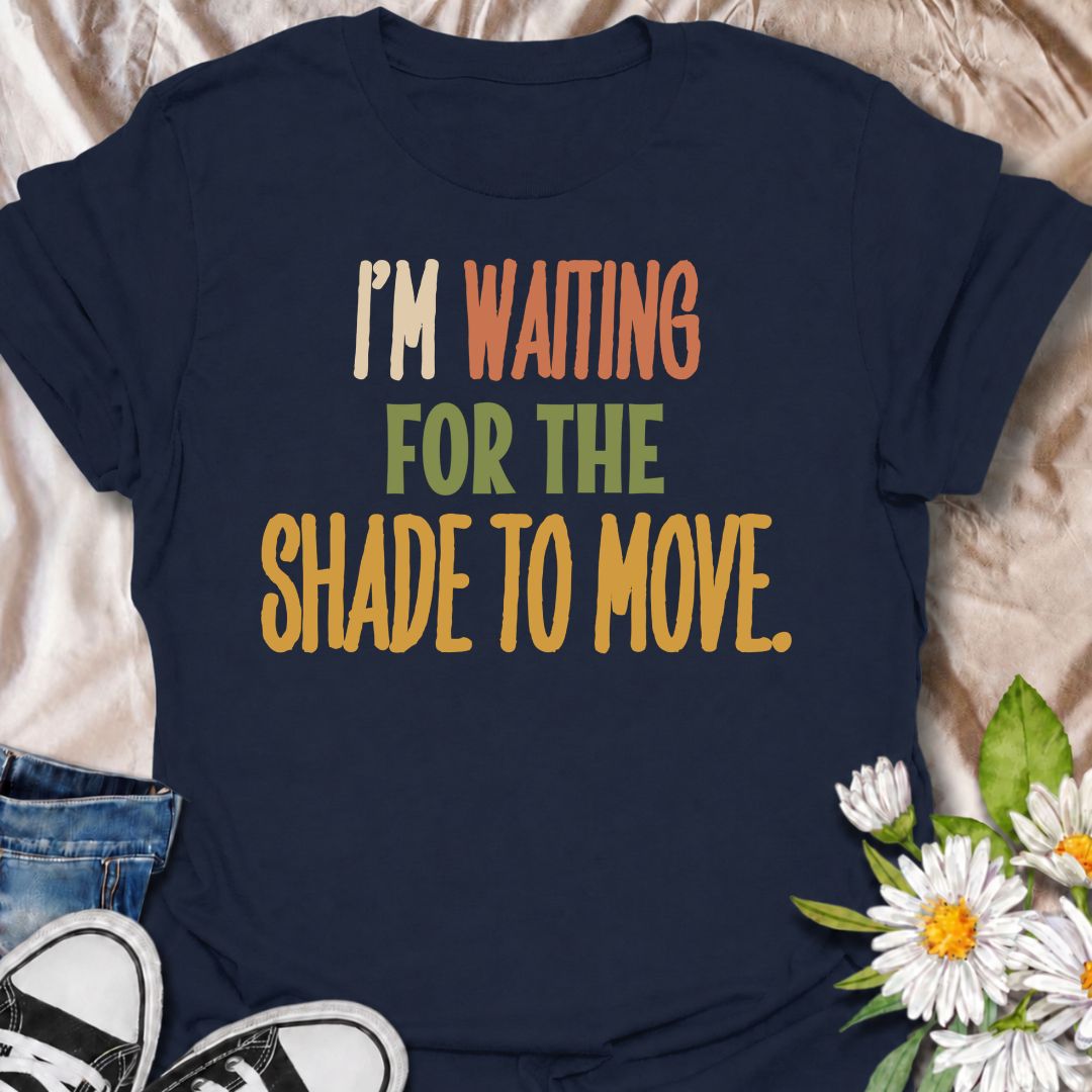 A funny gardening T-shirt for anyone who knows a “quick job” in the garden can turn into a full afternoon outside. The phrase “I’m Waiting for the Shade to Move” captures that familiar gardener habit of working around the sun instead of calling it a day. Its bold retro typography keeps the design simple, readable, and easy to wear. It makes a great gift for backyard gardeners, flower growers, vegetable gardeners, and anyone who plans garden jobs around the heat. Ideal for garden days, nursery trips, farmers